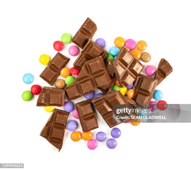 chocolate and coloured candy - pile of candy ストックフォトと画像