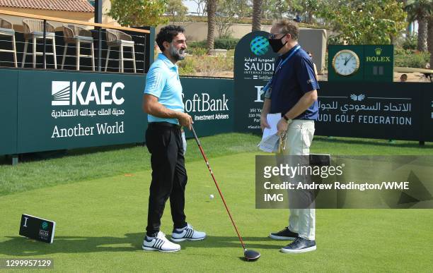 His Excellency Yasir Al-Rumayyan, Chairman Saudi Golf Federation, talks with Ross Hallett, VP, Golf IMG, during a practice round prior to the start...