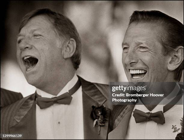 Portrait of retired American baseball players Billy Martin and Mickey Mantle , both of the New York Yankees, share a laugh during an unspecified,...