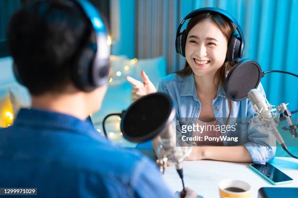 people make podcast in studio - television host stock pictures, royalty-free photos & images