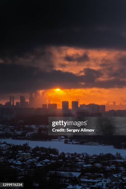 dramatic cloudscape above cityscape in winter morning - krasnogorsky district moscow oblast stock pictures, royalty-free photos & images