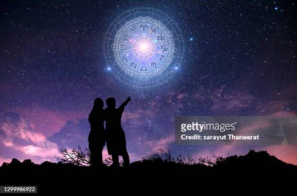 zodiac signs inside of horoscope circle. astrology in the sky with many stars and moons  astrology and horoscopes concept - star signs stock pictures, royalty-free photos & images
