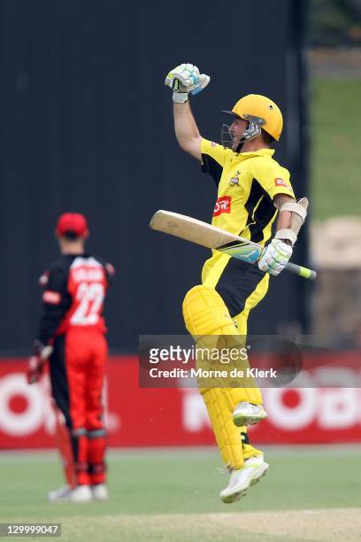 Luke Ronchi of the Warriors celebrate after scoring 100 runs during the Ryobi One Day Cup match between the South Australia Redbacks and the Western...