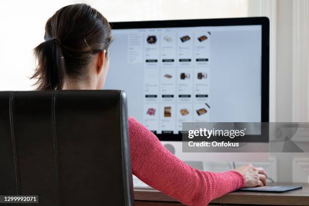 woman grocery shopping online on her computer from home - category:internet stock pictures, royalty-free photos & images