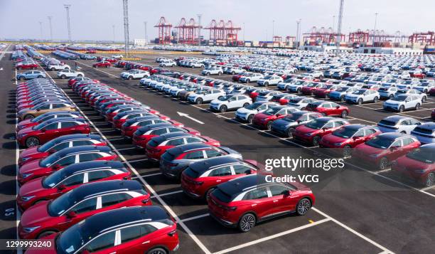 Aerial view of SAIC Volkswagen ID.4 electric sport-utility vehicles sitting parked at a port along the Yangtze River on February 2, 2021 in Suzhou,...
