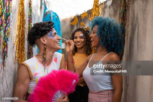 preparing for carnival - man make up stock pictures, royalty-free photos & images