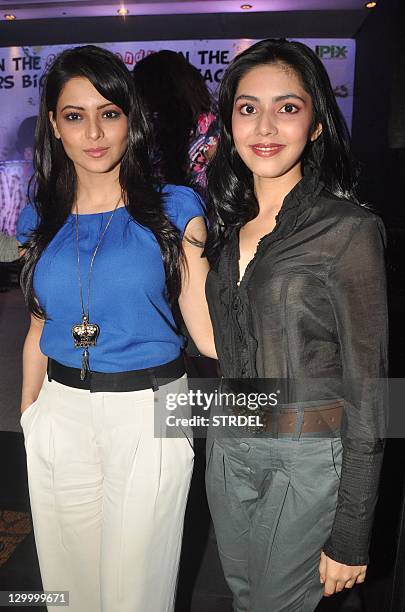 Indian Bollywood personalities Aamna Sharif and Umang Jain pose during a promotional event for the forthcoming Hindi film "Shakal Pe Mat Ja" in...