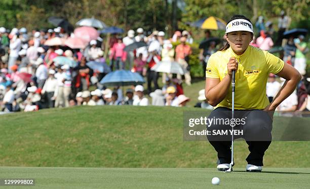 Amy Yang of South Korea lines up a putt on the eigth green during the forth round of the Sunrise LPGA Taiwan Championship golf tournament in Yangmei,...