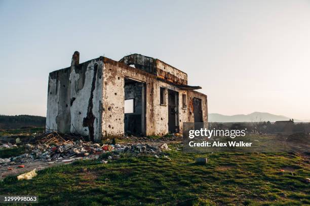 destroyed building with bullet holes. - bullet hole in wood stock pictures, royalty-free photos & images