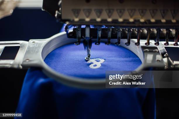 close up of embroidery machine head with blue fabric - broderi bildbanksfoton och bilder
