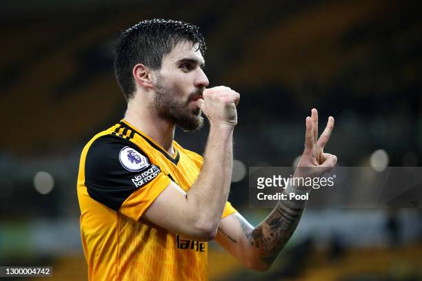 Ruben Neves of Wolverhampton Wanderers celebrates after scoring their side's first goal from the penalty spot during the Premier League match between...