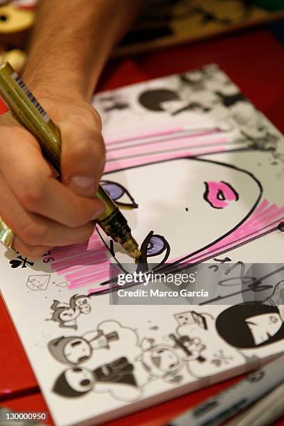 Tokidoki creator Simone Legno sketches one of his signature characters during an event at Sephora at the Ala Moana Center on October 22, 2011 in...