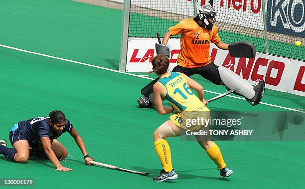 Kellie White of Australia scores a goal as Jaspreet Kaur and goalkeeper Yogita Bali try to defend during the women's final at the International Super...