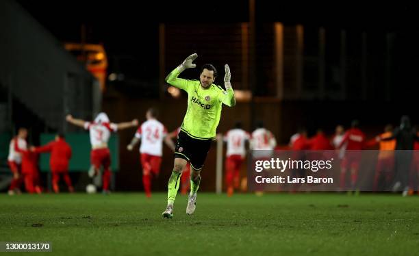 Daniel Davari of Rot-Weiss Essen celebrates after Simon Engelmann of Rot-Weiss Essen scores their sides second goal during the DFB Cup Round of...