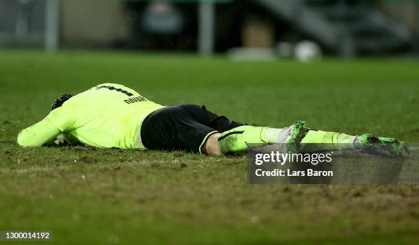 Daniel Davari of Rot-Weiss Essen reacts following their side's victory after the DFB Cup Round of Sixteen match between Rot-Weiss Essen and Bayer...