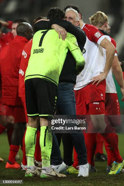 Christian Neidhart, Head Coach of Rot-Weiss Essen embraces Daniel Davari of Rot-Weiss Essen following their side's victory after the DFB Cup Round of...