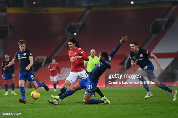 Kayne Ramsay of Southampton tackles Edinson Cavani of Manchester United during the Premier League match between Manchester United and Southampton at...