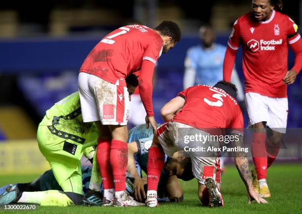 Players check on Amadou Bakayoko of Coventry City as he lies injured during the Sky Bet Championship match between Coventry City and Nottingham...