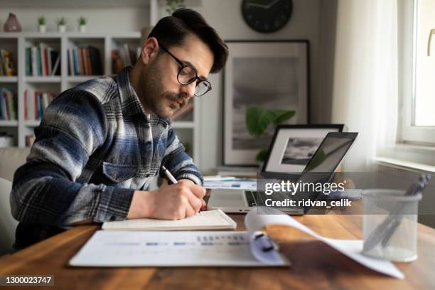 business accounting concept, business man using calculator with computer laptop, budget and loan paper in office. - accounting calculator stock pictures, royalty-free photos & images
