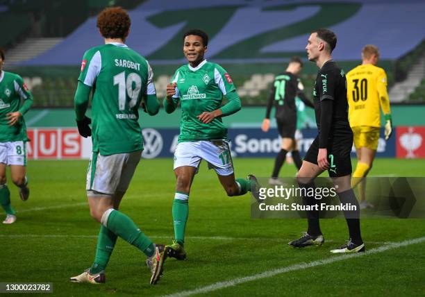 Felix Agu of Werder Bremen celebrates after scoring their side's second goal during the DFB Cup Round of Sixteen match between Werder Bremen and...