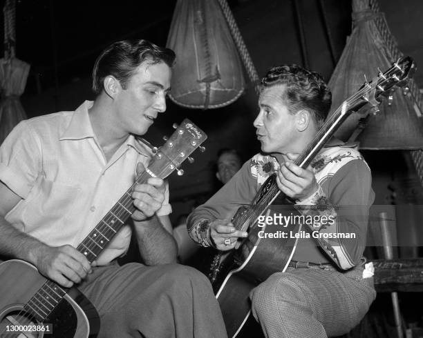 Country singer songwriter Faron Young with Little Jimmy Dickens backstage at the Grand Ole Opry in 1951 in Nashville, Tennessee.