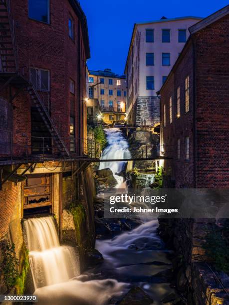 urban waterfall in old industrial area, kvarnbyn near molndal, sweden - molndal stock pictures, royalty-free photos & images