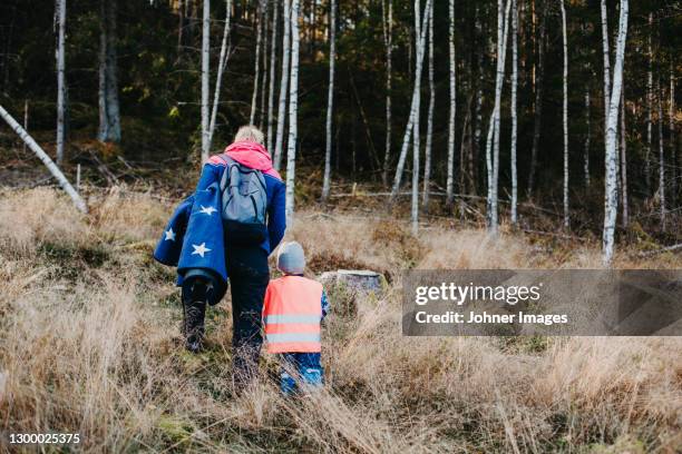 rear view of mother walking with child - preschool classroom plants stock pictures, royalty-free photos & images