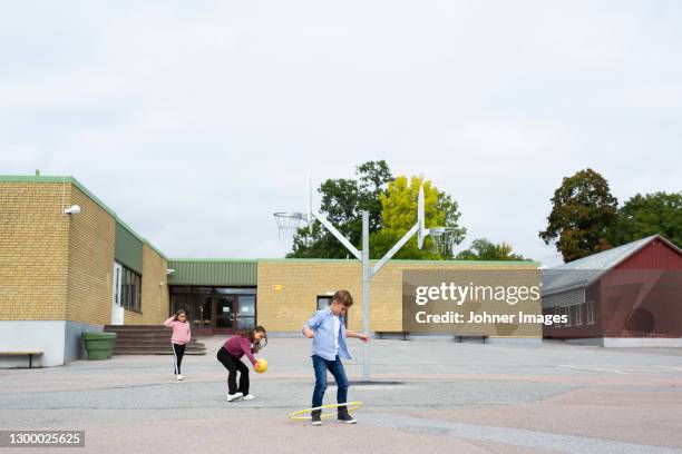 children playing on school yard - skolgård bildbanksfoton och bilder