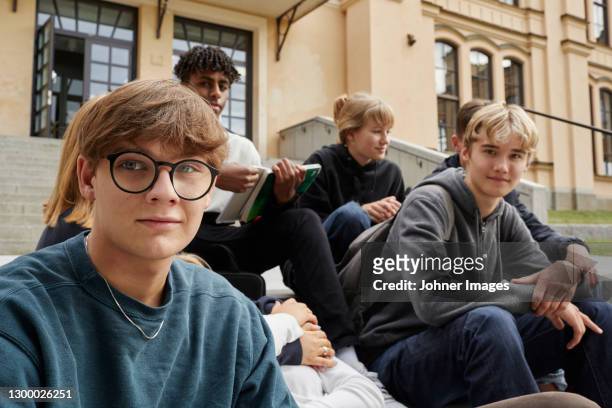 teenagers sitting in front of school - uppsala stock pictures, royalty-free photos & images