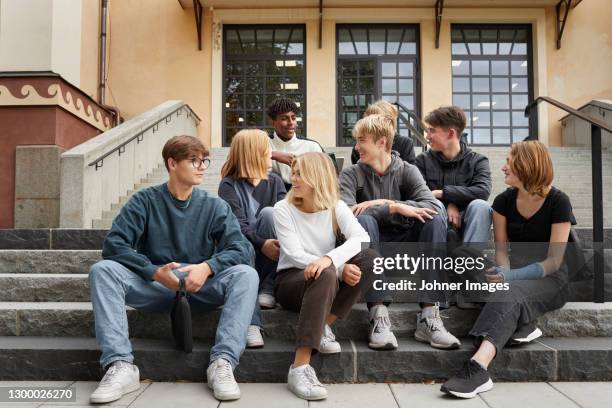 teenagers in front of school - school yard stock pictures, royalty-free photos & images