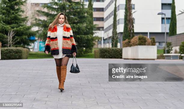 stylish woman walking outdoors in autumn. - brown boot bildbanksfoton och bilder