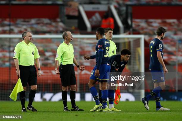 Kayne Ramsay of Southampton interacts with Referee, Mike Dean after the Premier League match between Manchester United and Southampton at Old...