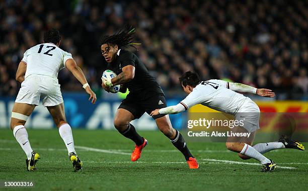 Ma'a Nonu of the All Blacks is challenged by Maxime Mermoz and Francois Trinh-Duc of France during the 2011 IRB Rugby World Cup Final match between...