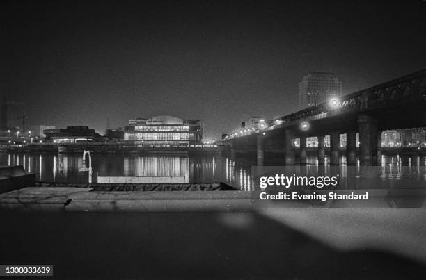 The Royal Festival Hall as seen from across the River Thames in London, with the Hungerford Bridge on the right, UK, 15th February 1972.