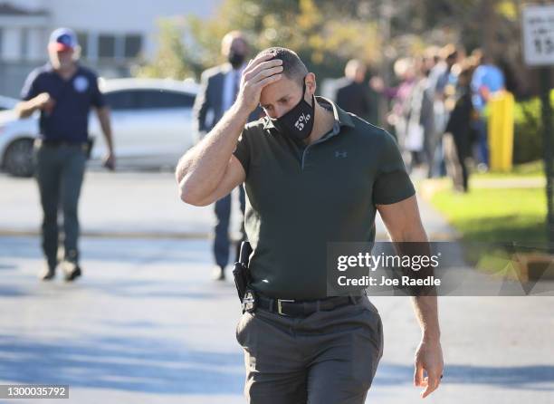 Law enforcement members leave the Broward County Office of Medical Examiner and Trauma Services after the killing of two FBI agents on February 02,...