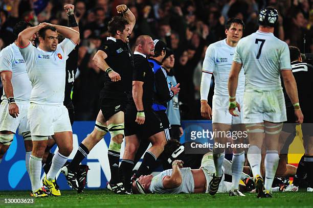 Captain Richie McCaw of the All Blacks jumps in the air as All Black payers celebrate after an 8-7 victory in the 2011 IRB Rugby World Cup Final...