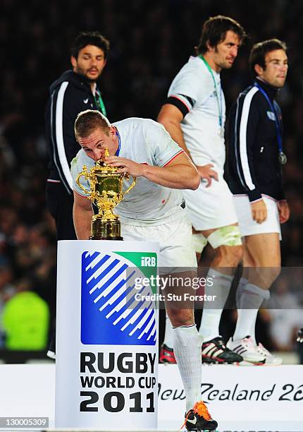 Imanol Harinordoquy of France kisses the Webb Ellis Cup after collecting his runner up medal after the 2011 IRB Rugby World Cup Final match between...