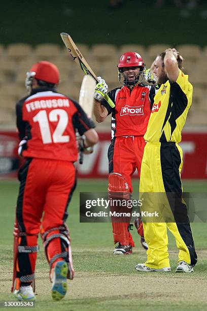 Nathan Lyon and Callum Ferguson of the Redbacks celebrates as Nathan Rimmington of the Lions reacts after the Ryobi One Day Cup match between the...