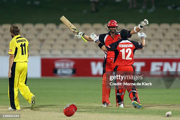 Nathan Lyon and Callum Ferguson of the Redbacks celebrates as Nathan Rimmington of the Lions reacts after the Ryobi One Day Cup match between the...