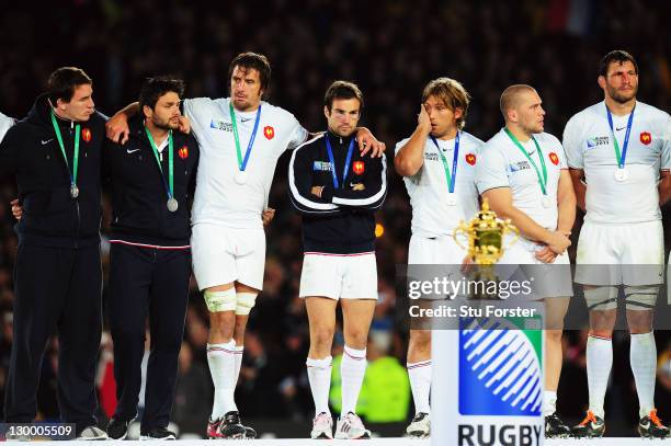 Morgan Parra of France looks at the Webb Ellis Cup dejected as France collect their runners up medals after the 2011 IRB Rugby World Cup Final match...