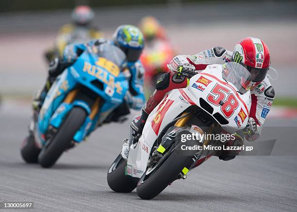 Marco Simoncelli of Italy and San Carlo Honda Gresini leads the field during the MotoGP race of MotoGP of Malaysia at Sepang Circuit on October 23,...