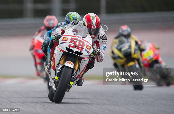 Marco Simoncelli of Italy and San Carlo Honda Gresini leads the field during the MotoGP race of MotoGP of Malaysia at Sepang Circuit on October 23,...