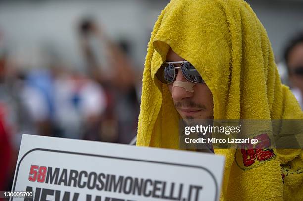 Marco Simoncelli of Italy and San Carlo Honda Gresini prepares to start on the grid of the MotoGP race of MotoGP of Malaysia at Sepang Circuit on...