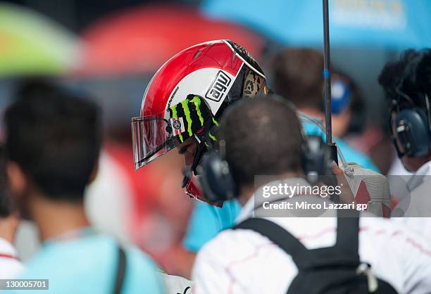 Marco Simoncelli of Italy and San Carlo Honda Gresini prepares to start on the grid of the MotoGP race of MotoGP of Malaysia at Sepang Circuit on...