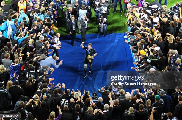 Captain Richie McCaw of the All Blacks lifts the Webb Ellis Cup to the fans after an 8-7 victory in during the 2011 IRB Rugby World Cup Final match...