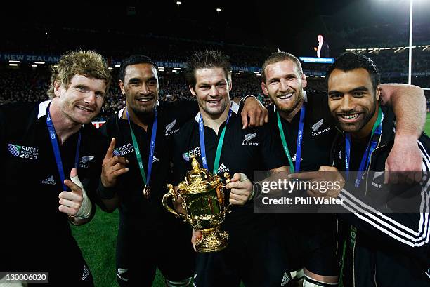 Adam Thomson, Jerome Kaino, Richie McCaw, Kieran Read and Victor Vito of the All Blacks pose with the Webb Ellis Cup after the 2011 IRB Rugby World...