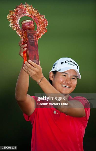 Yani Tsang poses with the trophy after winning the Sunrise LPGA Taiwan Championship at Sunrise Golf Course on October 23, 2011 in Taoyuan, Taiwan.