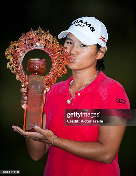 Yani Tsang poses with the trophy after winning the Sunrise LPGA Taiwan Championship at Sunrise Golf Course on October 23, 2011 in Taoyuan, Taiwan.