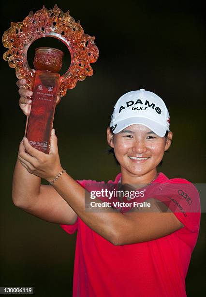 Yani Tsang poses with the trophy after winning the Sunrise LPGA Taiwan Championship at Sunrise Golf Course on October 23, 2011 in Taoyuan, Taiwan.