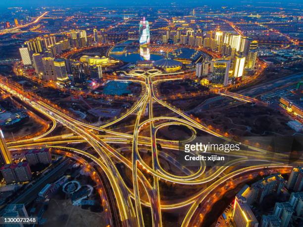 aerial view cityscape of zhengzhou cbd night in china - zhengzhou stock pictures, royalty-free photos & images